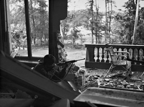 A British paratrooper in cover on the outskirts of Oosterbeek. The failure of XXX Corps to cross the Neder Rijn doomed the airborne operation